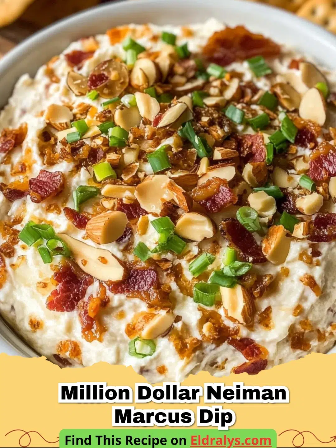 A bowl of Million Dollar Neiman Marcus Dip served with crackers and garnished with bacon.