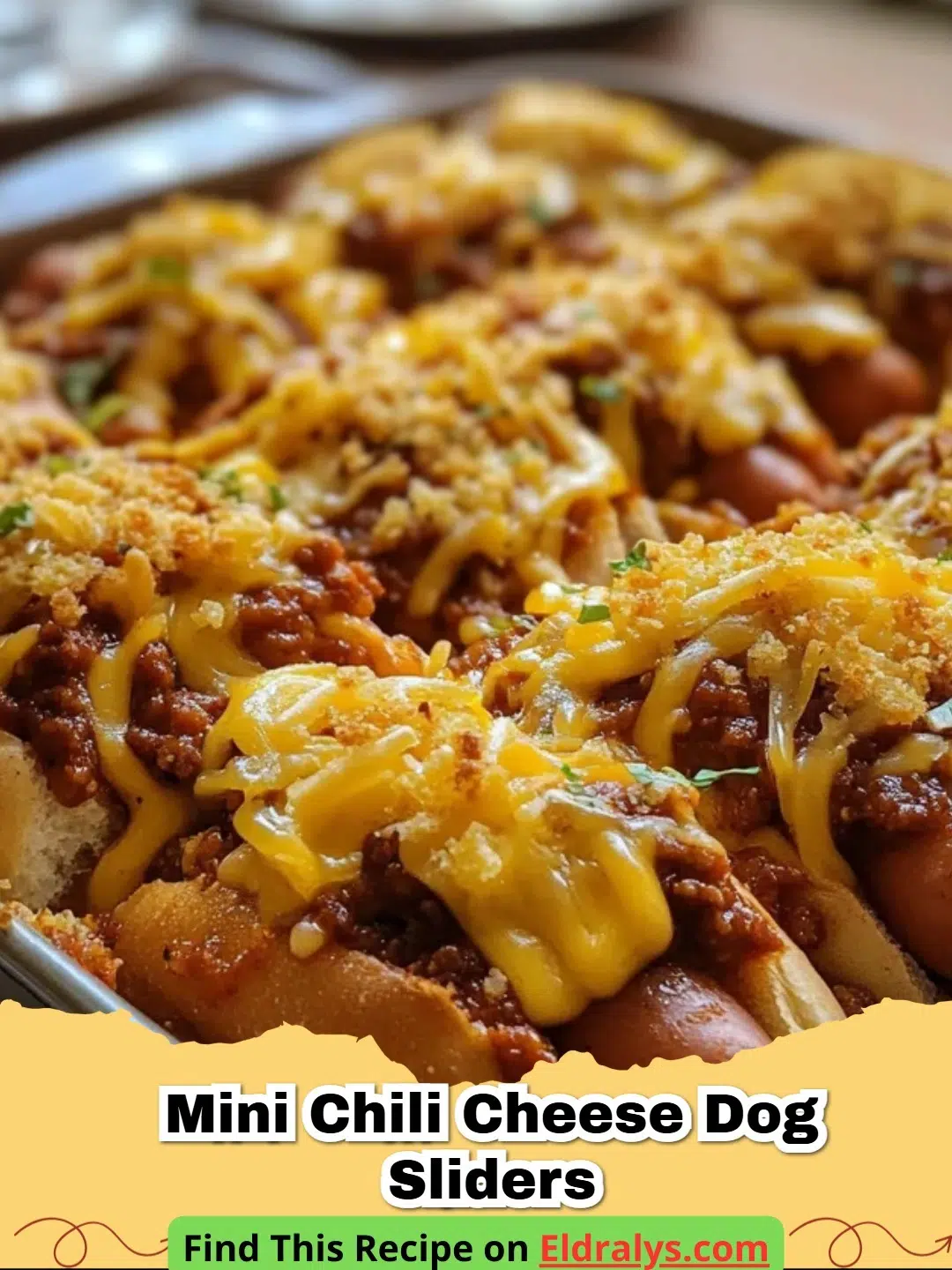 A close-up of cheesy Mini Chili Cheese Dog Sliders with melted cheddar and garlic butter glaze