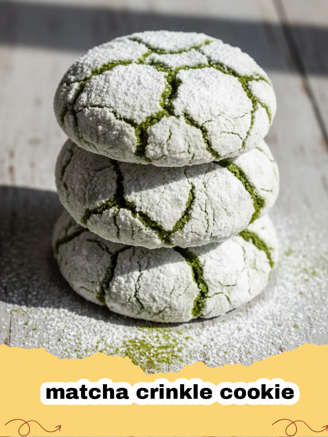 A stack of vibrant green matcha crinkle cookies coated in white powdered sugar on a ceramic plate.