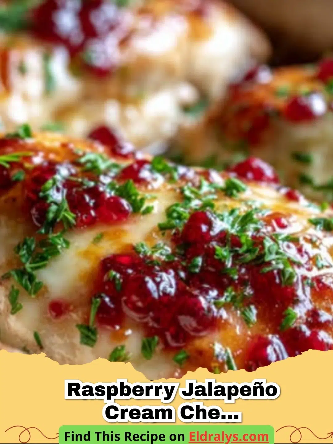 A close-up shot of Raspberry Jalapeño Cream Cheese Chicken Bake with melted cheese and red glaze.