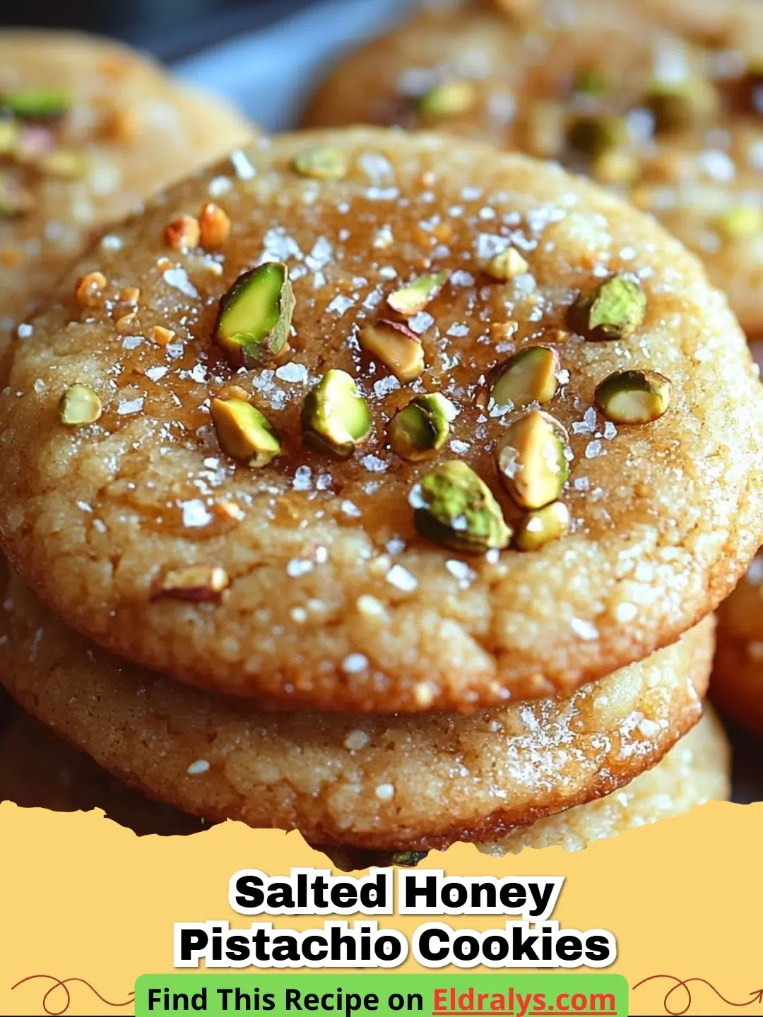 A close up photo of freshly baked cookies from our Salted Honey Pistachio Cookies Recipe with green nuts and sea salt