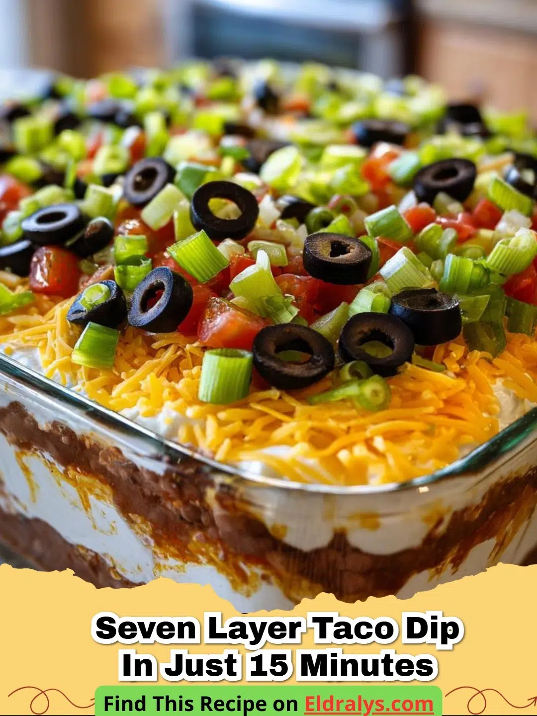 A close up of Seven Layer Taco Dip in Just 15 Minutes showing layers of beans, cream, and cheese.