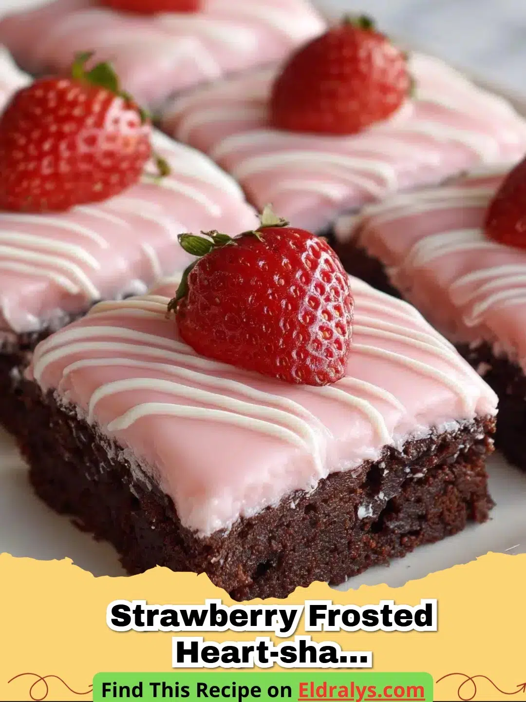 A tray of Strawberry Frosted Heart-Shaped Brownies with pink frosting and sprinkles