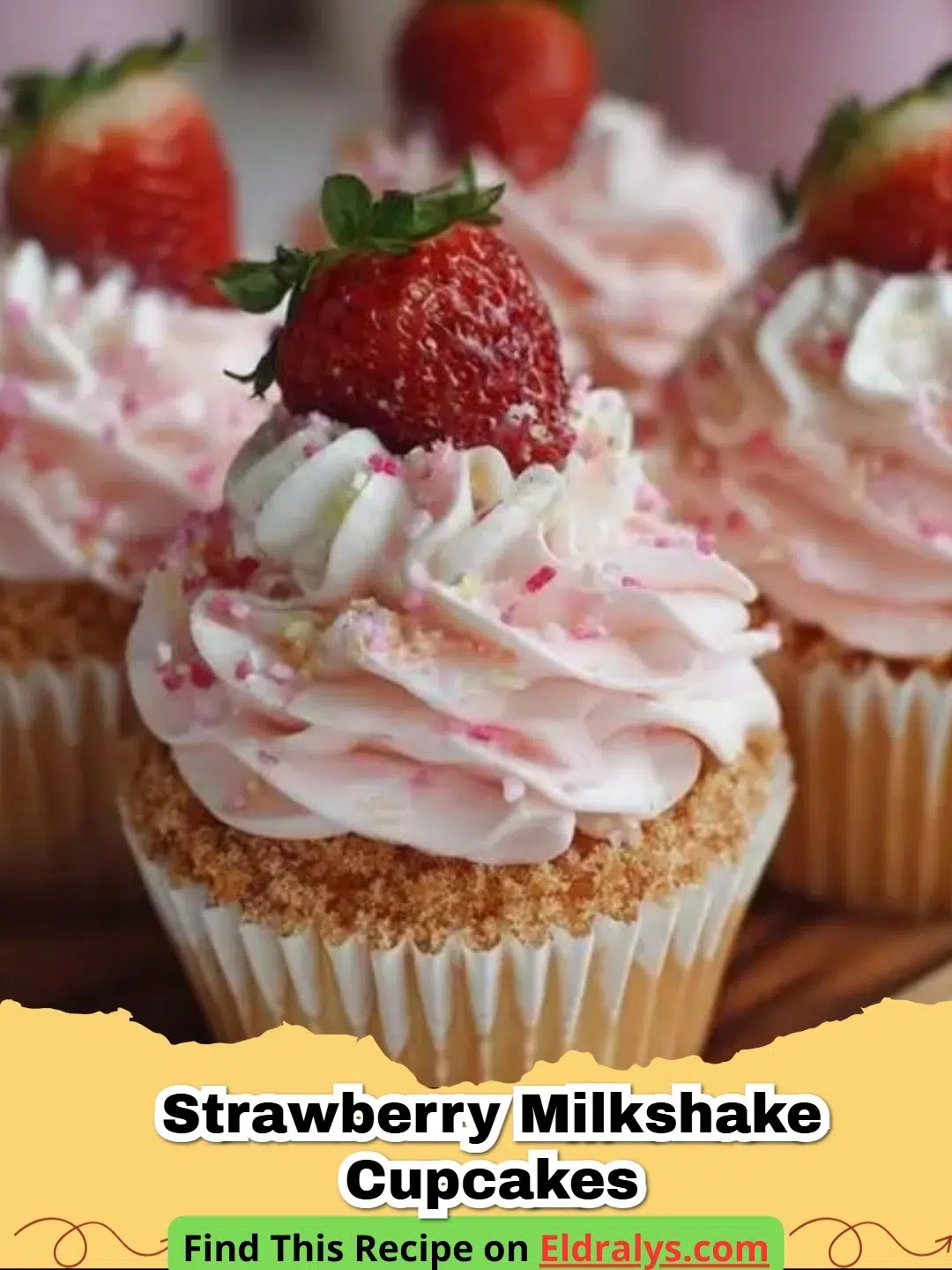 Close up of Strawberry Milkshake Cupcakes with pink frosting and a straw garnish
