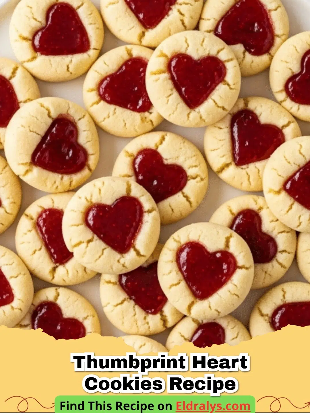 A close up of several jam-filled cookies from the Thumbprint Heart Cookies Recipe on a cooling rack.