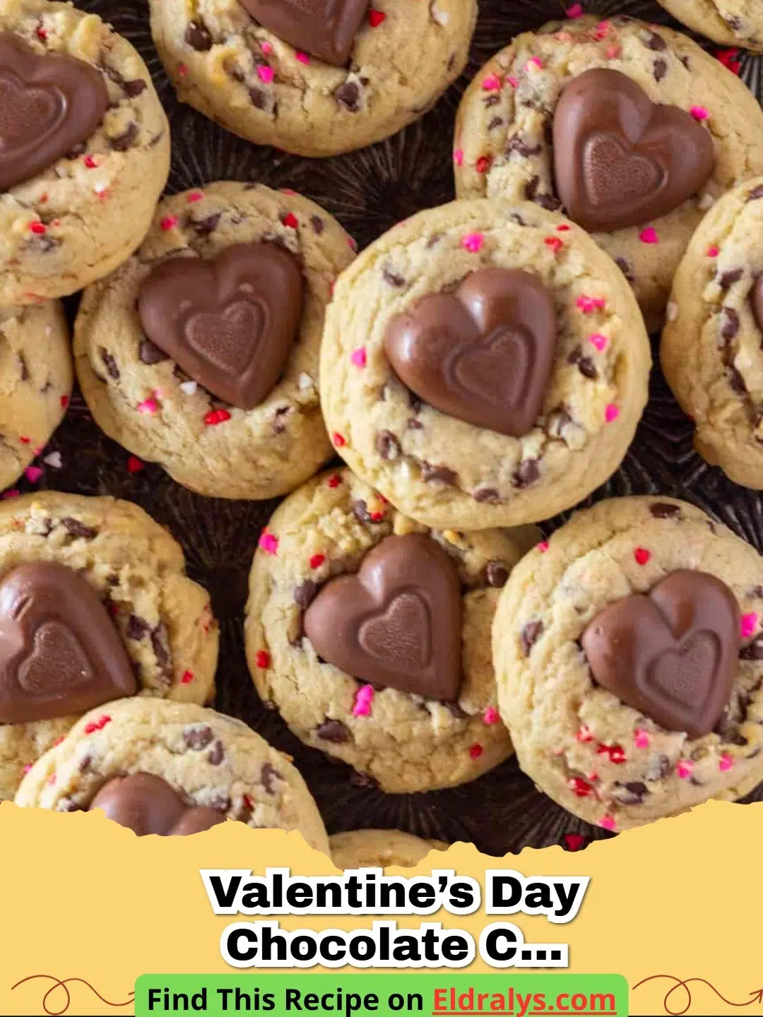 A tray of Valentine’s Day Chocolate Chip Cookies with pink sprinkles and chocolate hearts on top.