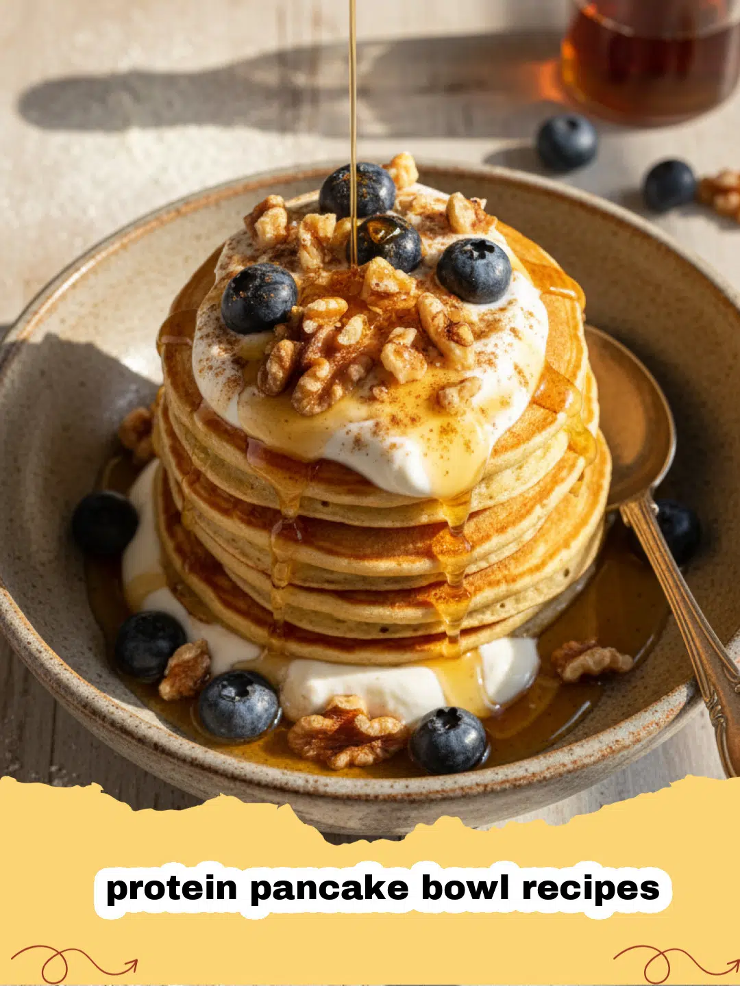 protein pancake bowl recipes - A fluffy protein pancake bowl topped with fresh berries and maple syrup.