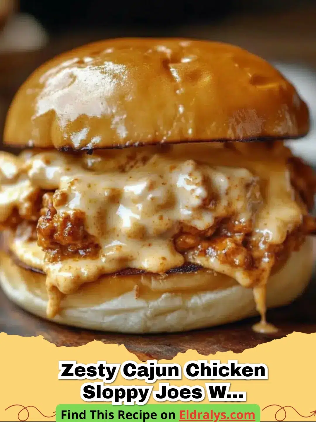 A close up of Zesty Cajun Chicken Sloppy Joes with Creamy Cheese Sauce on a toasted brioche bun with dripping cheese.