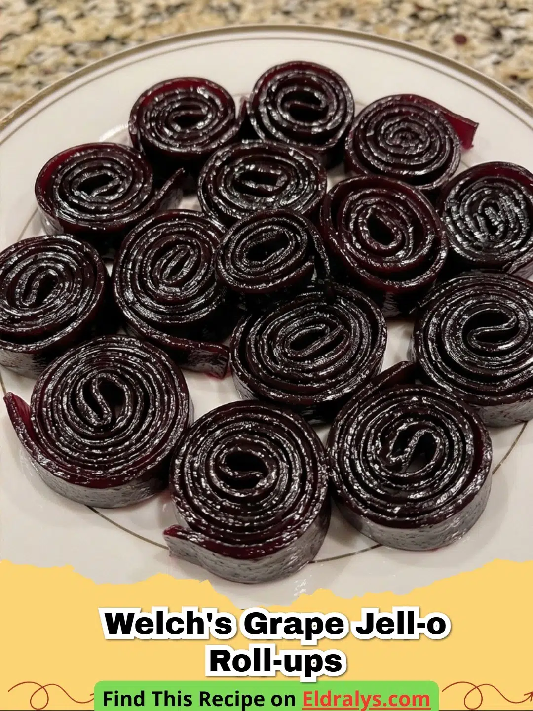 Close up of purple 3-Ingredient Welch's Grape Jell-O Roll-Ups rolled into spirals on parchment paper.