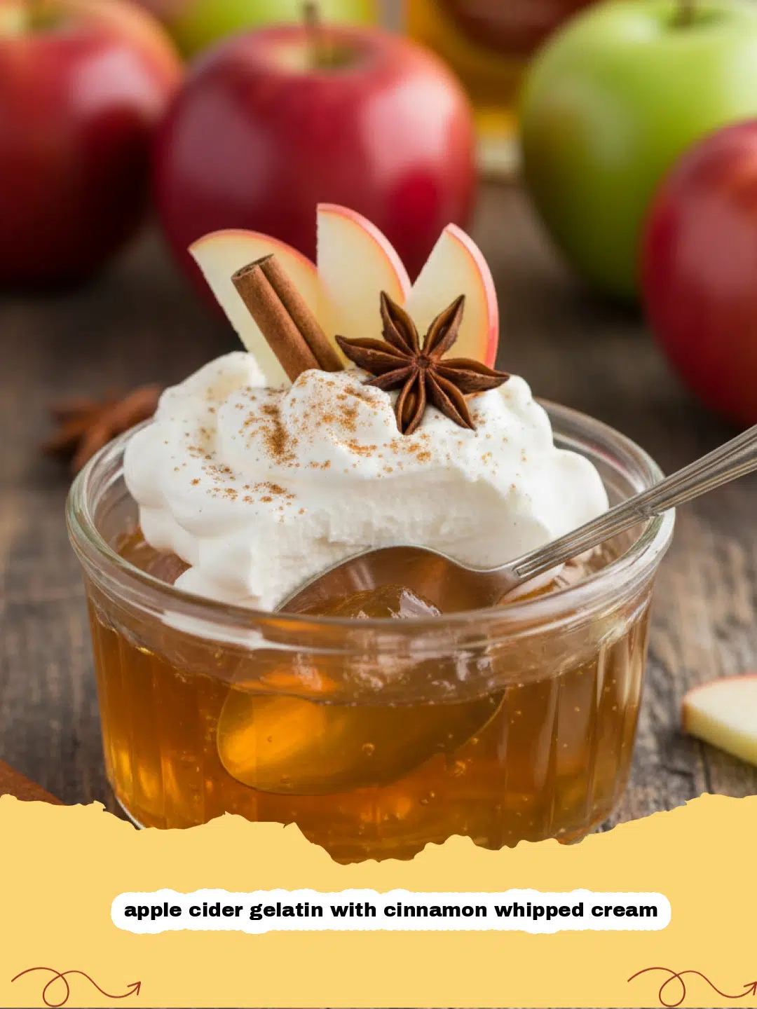 apple cider gelatin with cinnamon whipped cream - A glass bowl containing amber apple cider gelatin topped with a swirl of cinnamon whipped cream.