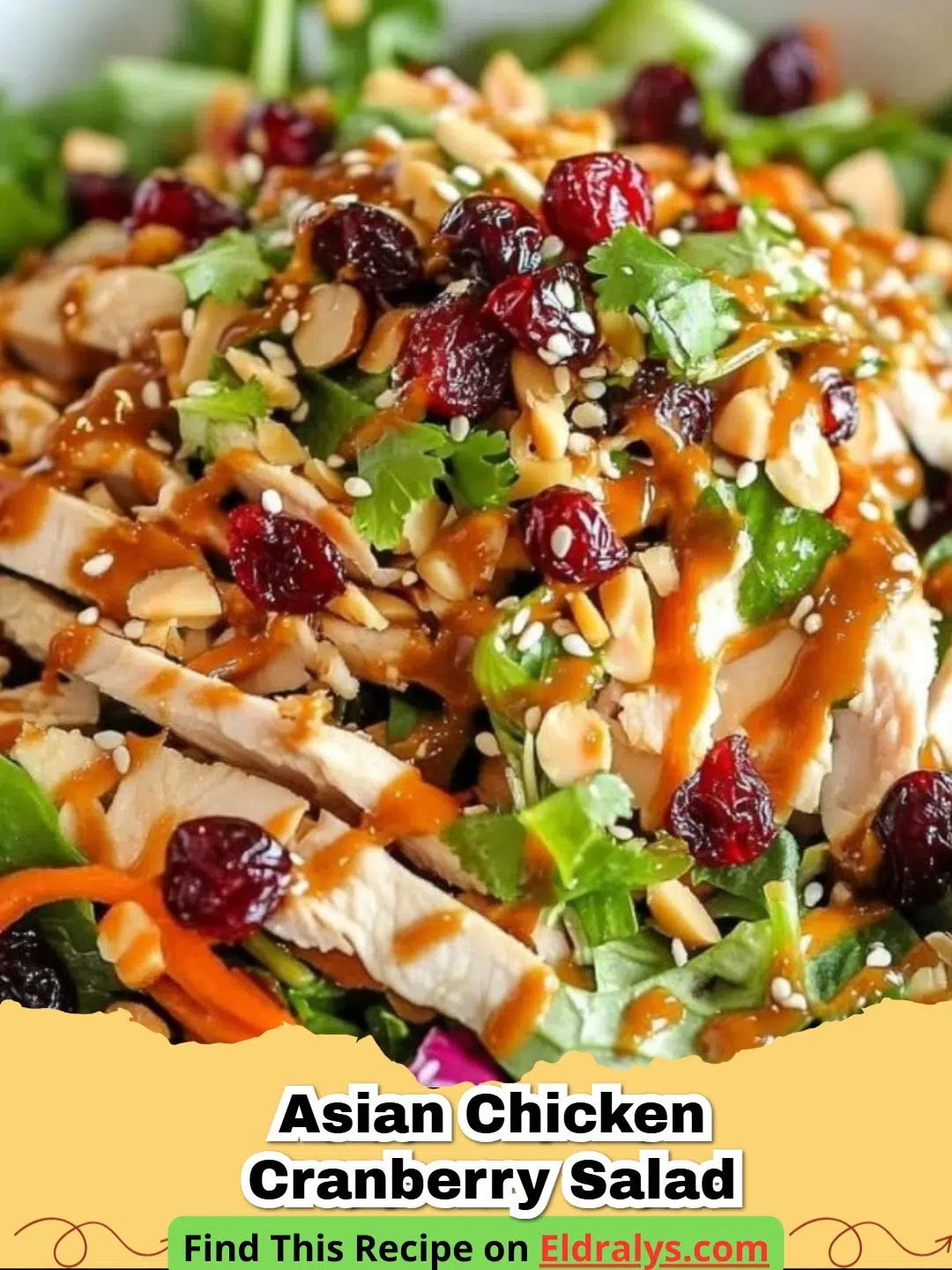 A close up of Asian Chicken Cranberry Salad in a white bowl with sesame seeds