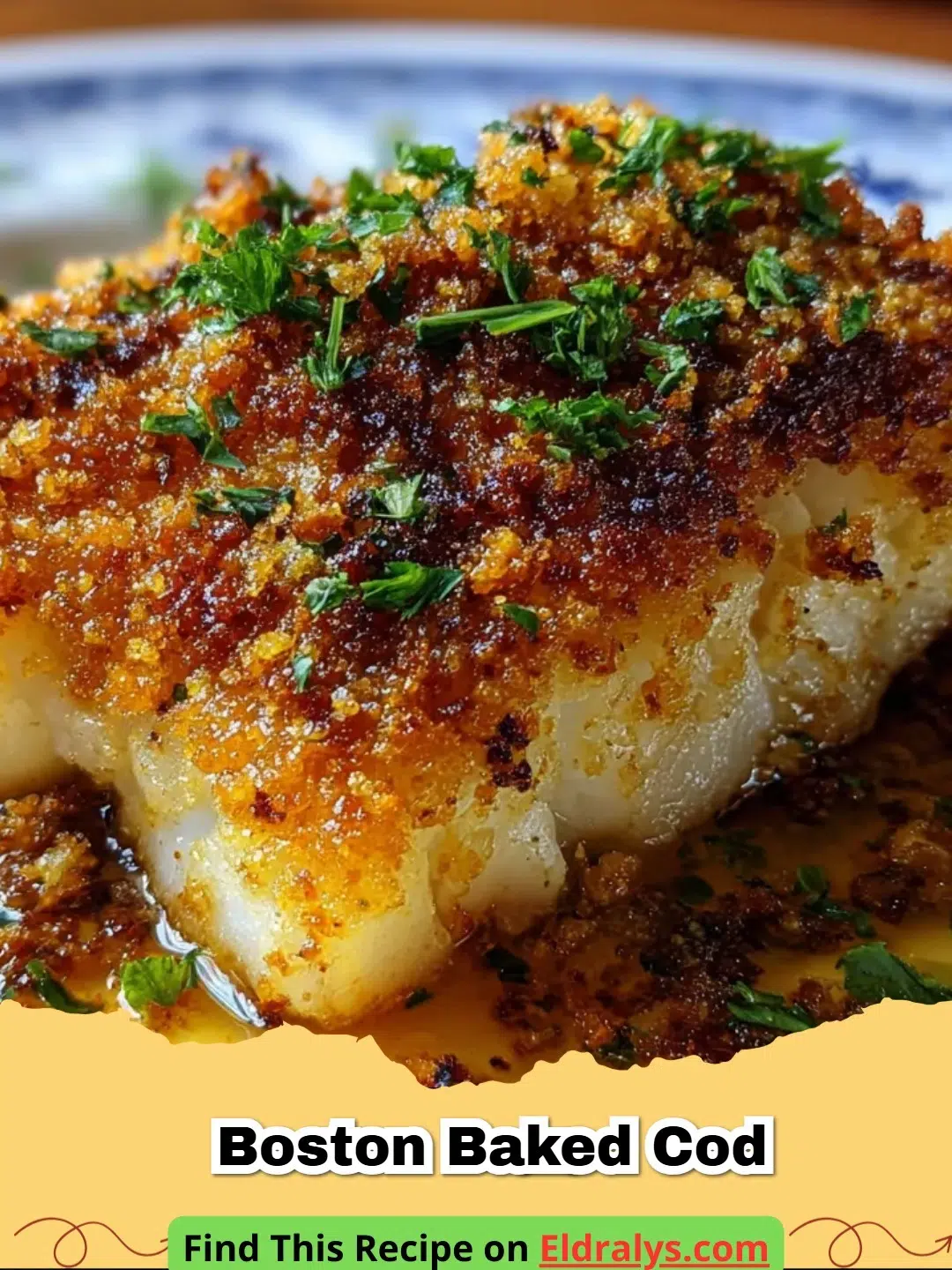 A close up of Boston Baked Cod with golden cracker crust and lemon wedges