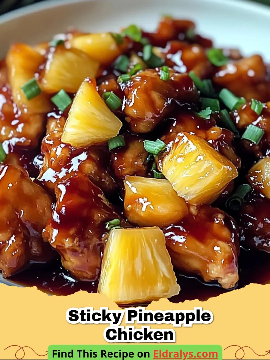 A plate of Sticky Pineapple Chicken served over white rice with green onion garnish