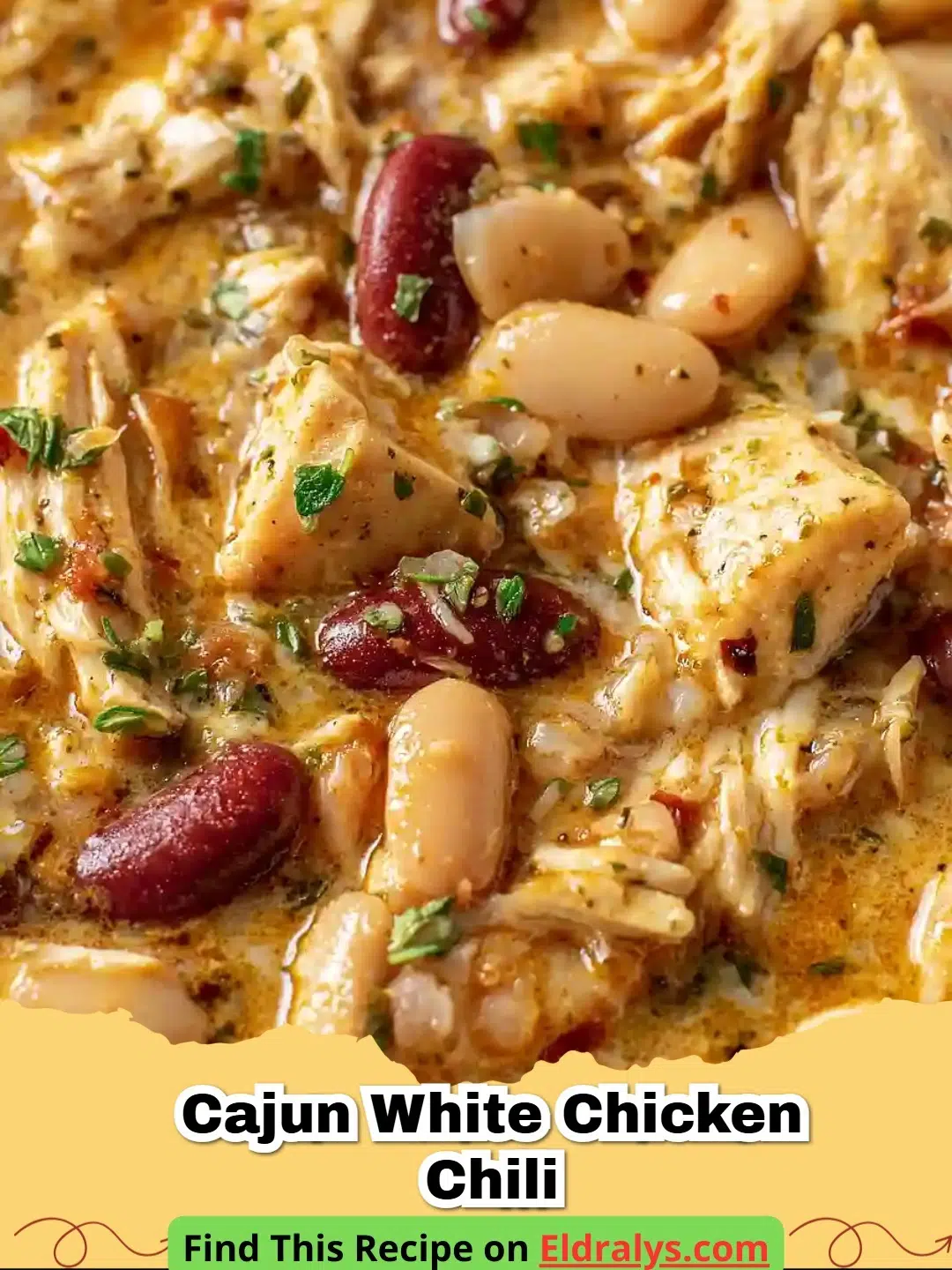 A bowl of Cajun White Chicken Chili topped with sour cream and cilantro
