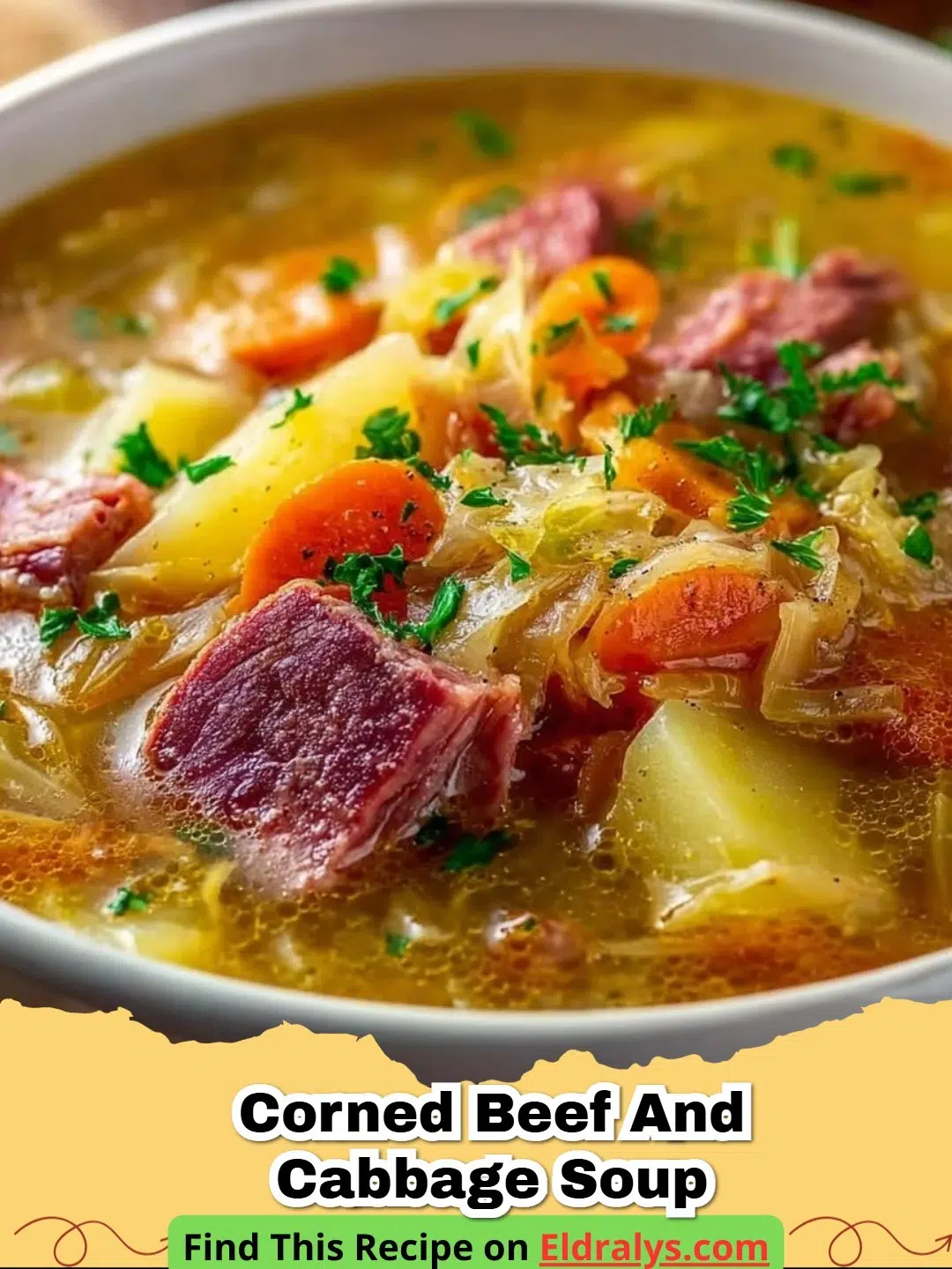 A steaming bowl of Corned Beef and Cabbage Soup with chunks of beef and potatoes.