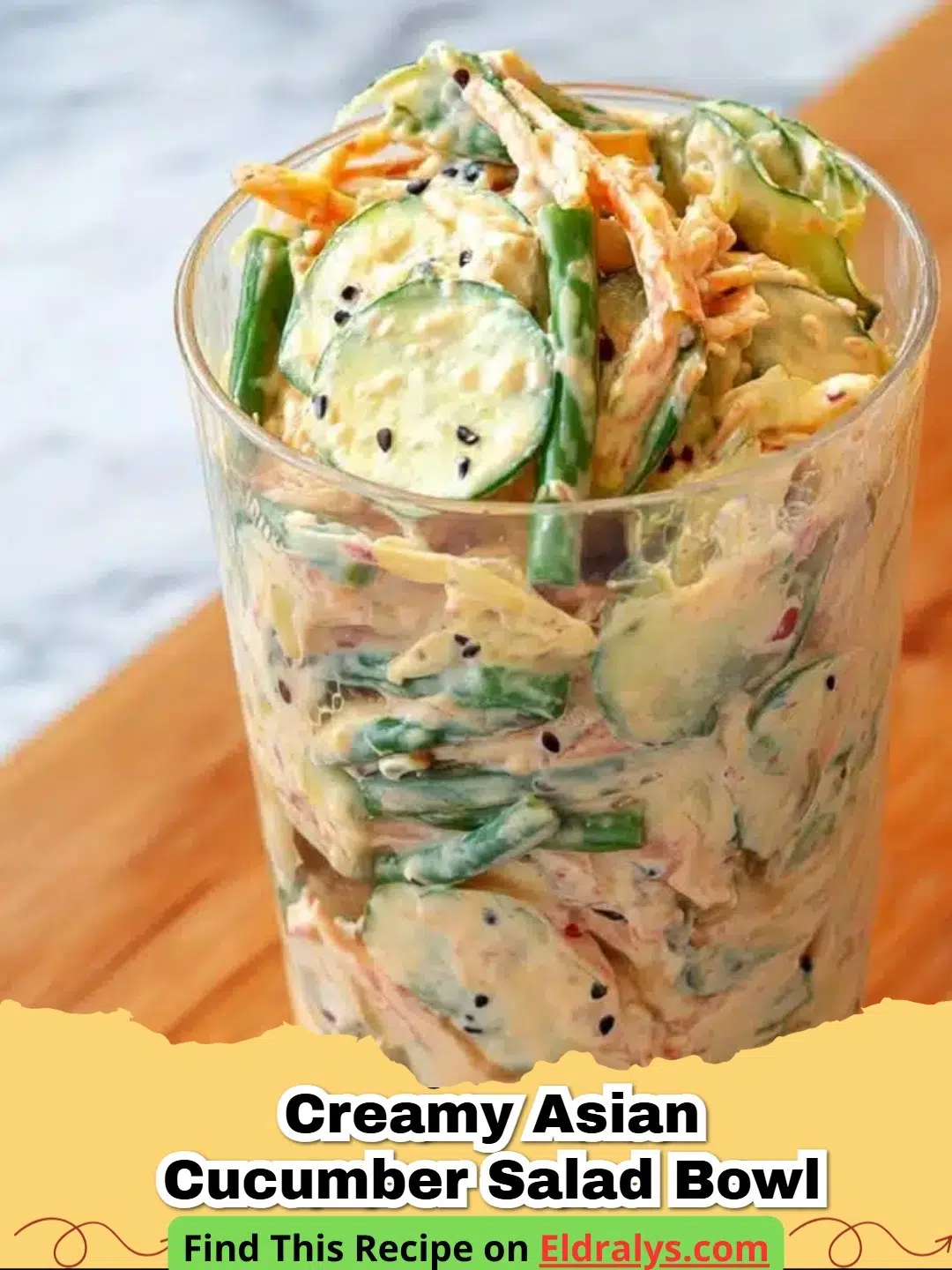 A close up shot of a Creamy Asian Cucumber Salad Bowl topped with black and white sesame seeds.
