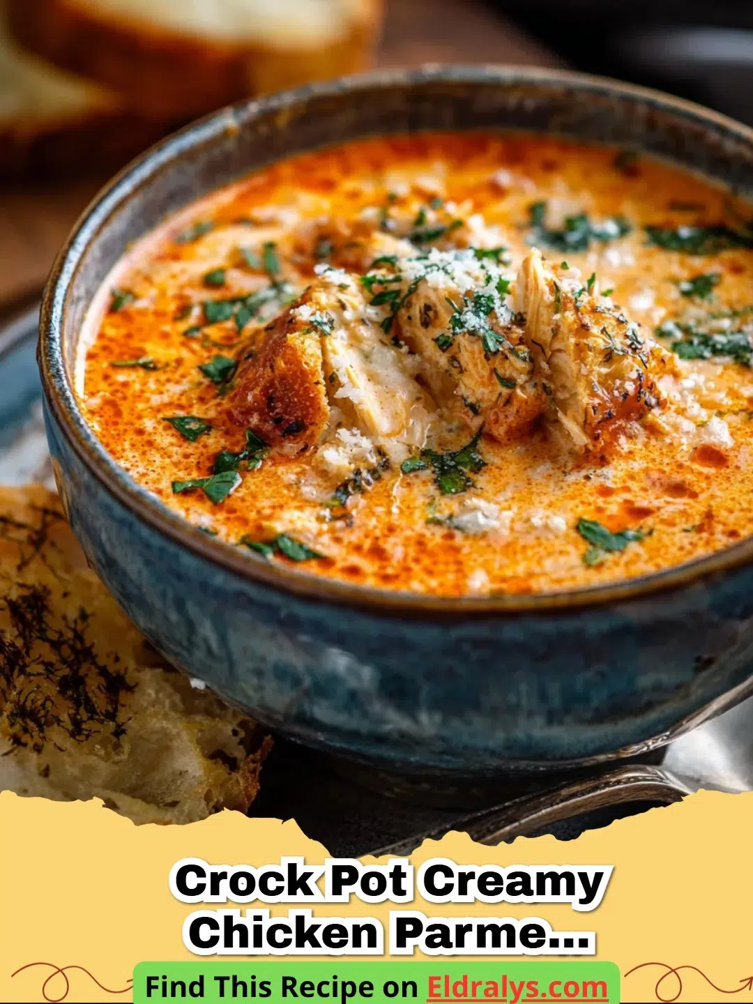 A bowl of Crock Pot Creamy Chicken Parmesan Soup garnished with fresh basil