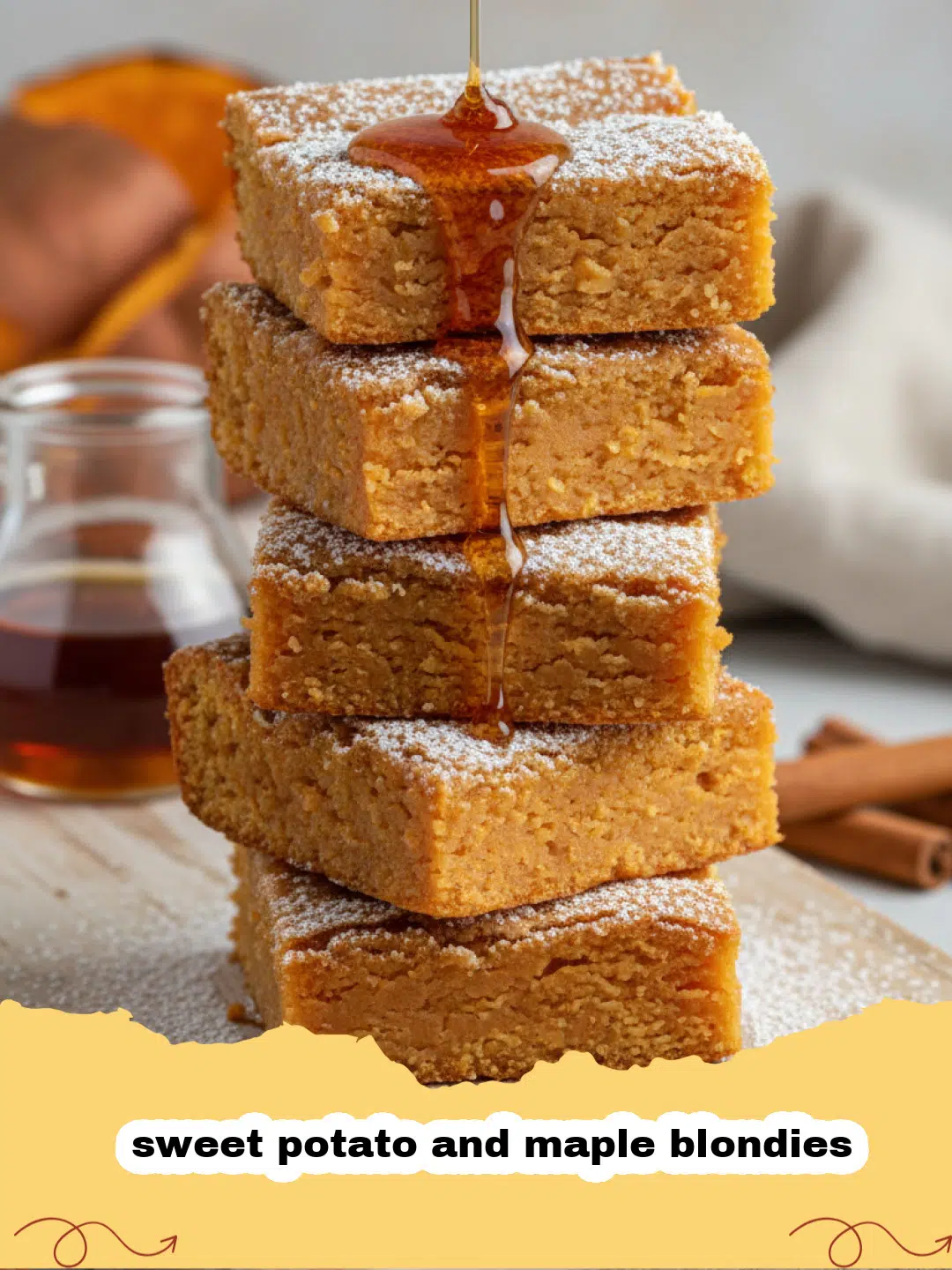 A tray of sliced sweet potato and maple blondies showing a fudgy texture and topped with pecans.