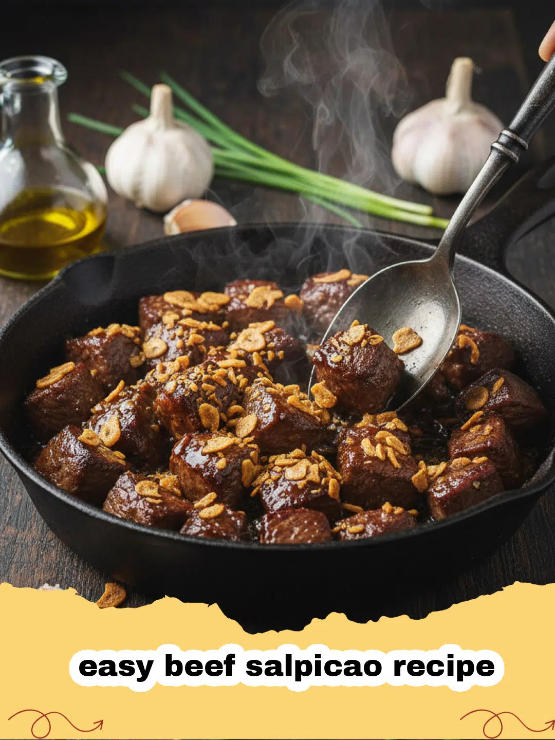 easy beef salpicao recipe - A close up of sizzling beef salpicao topped with crispy garlic chips in a cast iron pan.