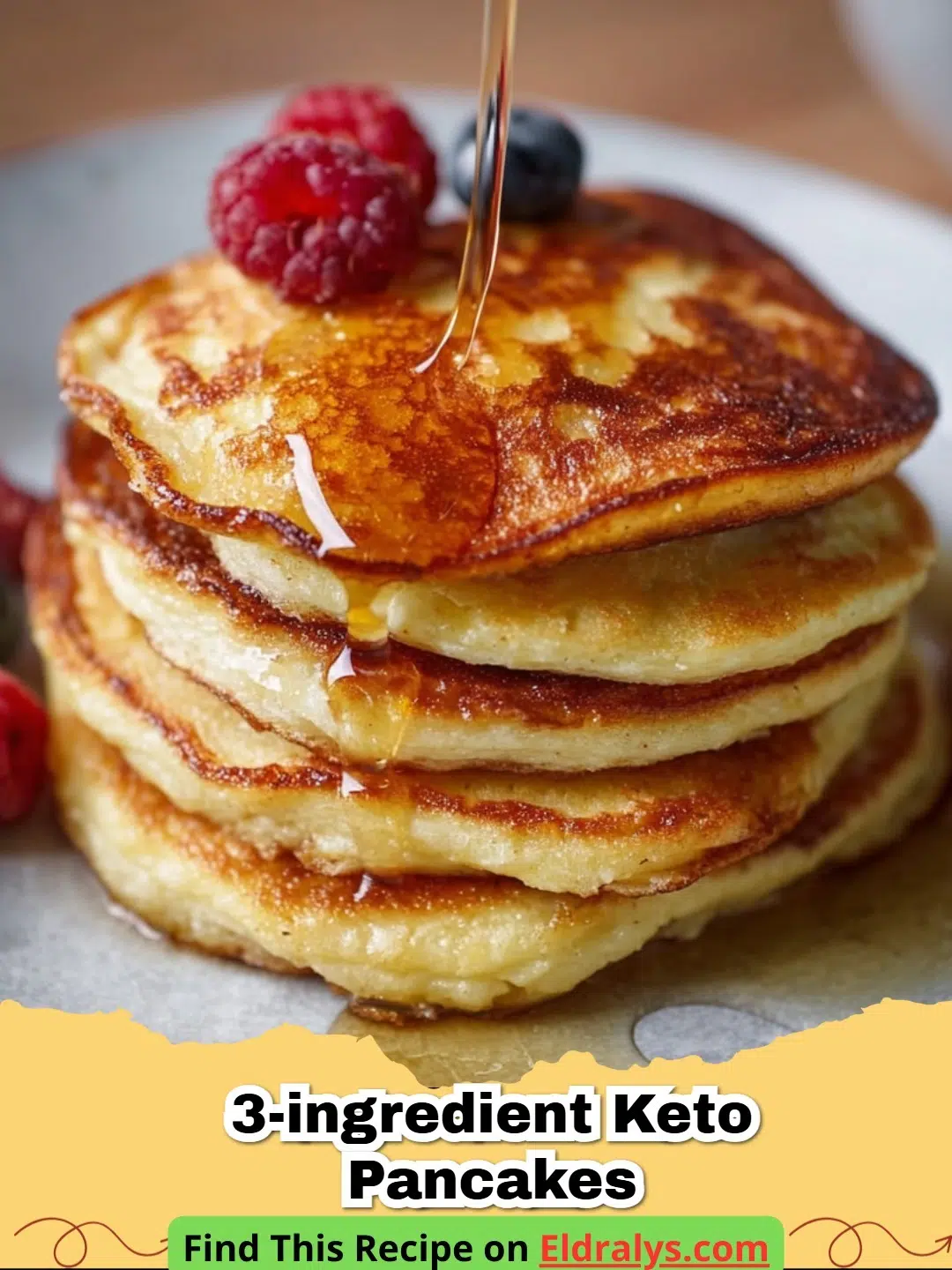 Stack of fluffy 3-Ingredient Keto Pancakes topped with berries