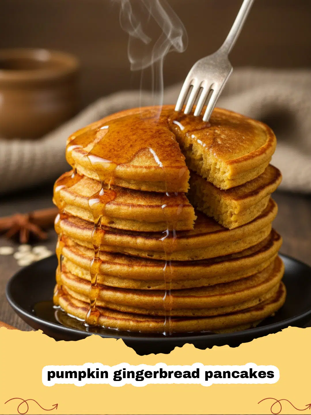 A stack of fluffy pumpkin gingerbread pancakes topped with butter and maple syrup.