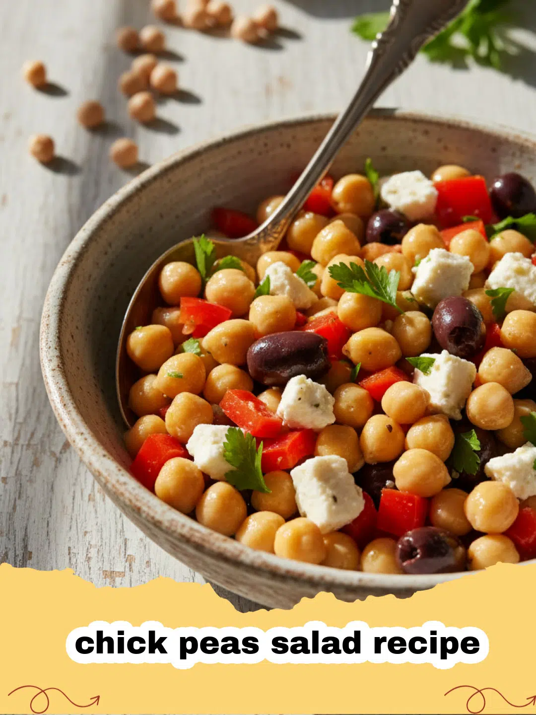 chick peas salad recipe - A colorful bowl of Mediterranean chick peas salad with feta, cucumbers, and tomatoes.