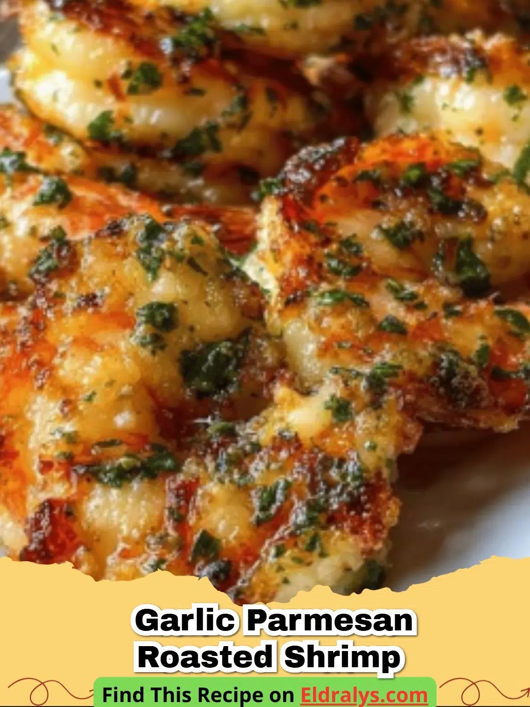 A baking sheet filled with Garlic Parmesan Roasted Shrimp garnished with parsley and lemons