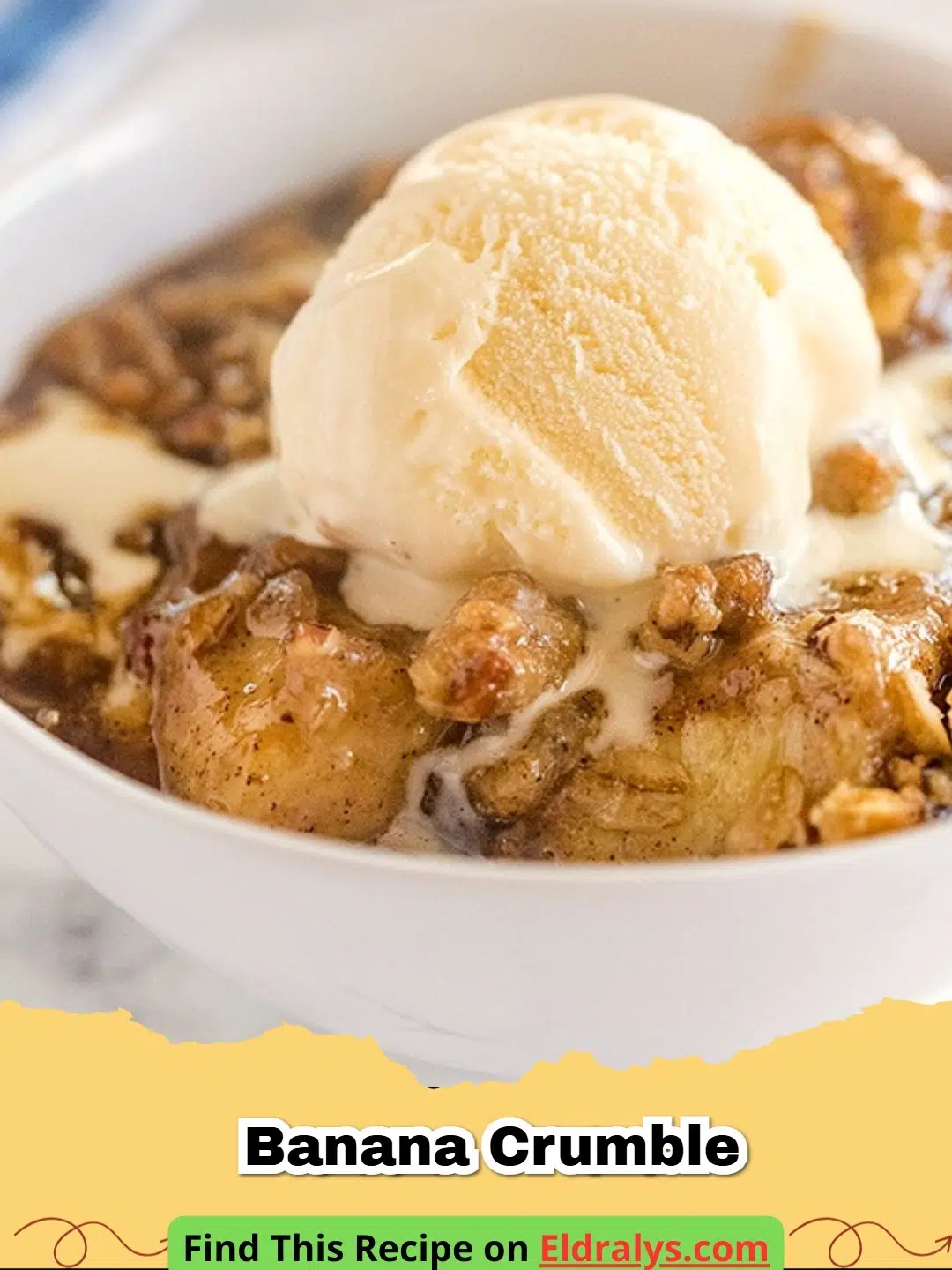 A warm dish of Banana Crumble with a scoop of melting vanilla ice cream.