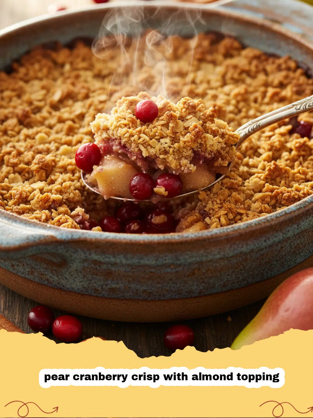 A golden-brown pear cranberry crisp with almond topping in a white ceramic baking dish.