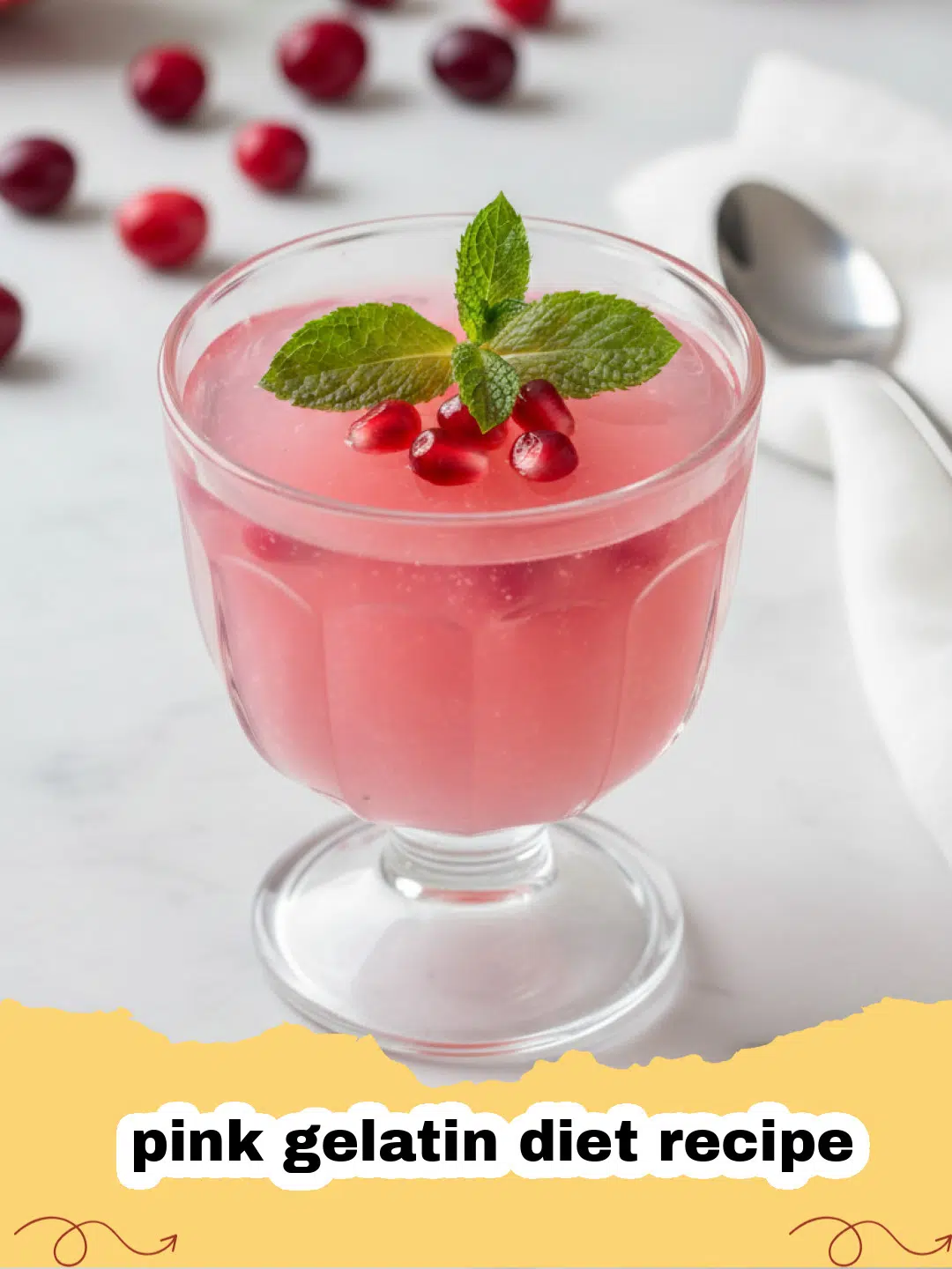A bowl of fluffy pink gelatin diet recipe topped with a fresh strawberry.