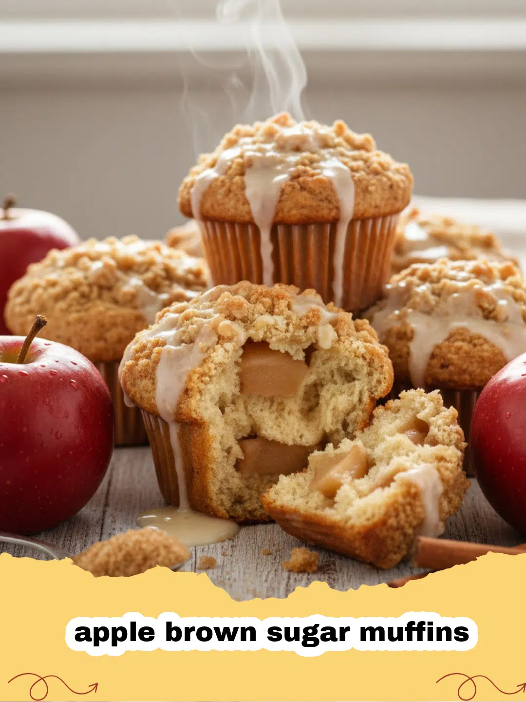 A stack of golden brown apple brown sugar muffins with a crumbly topping on a wooden board.
