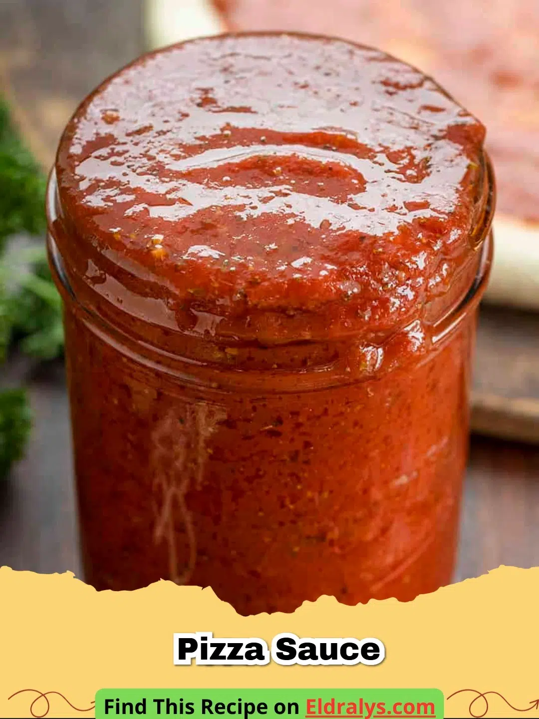 Fresh red Pizza Sauce in a glass bowl with herbs