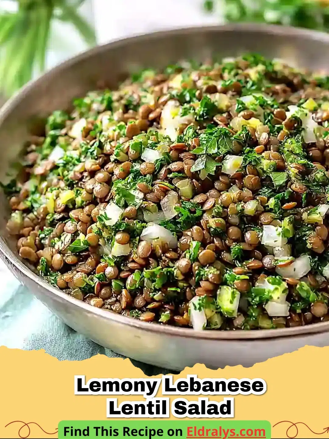 A close up bowl of Lemony Lebanese Lentil Salad with fresh parsley and lemon wedges