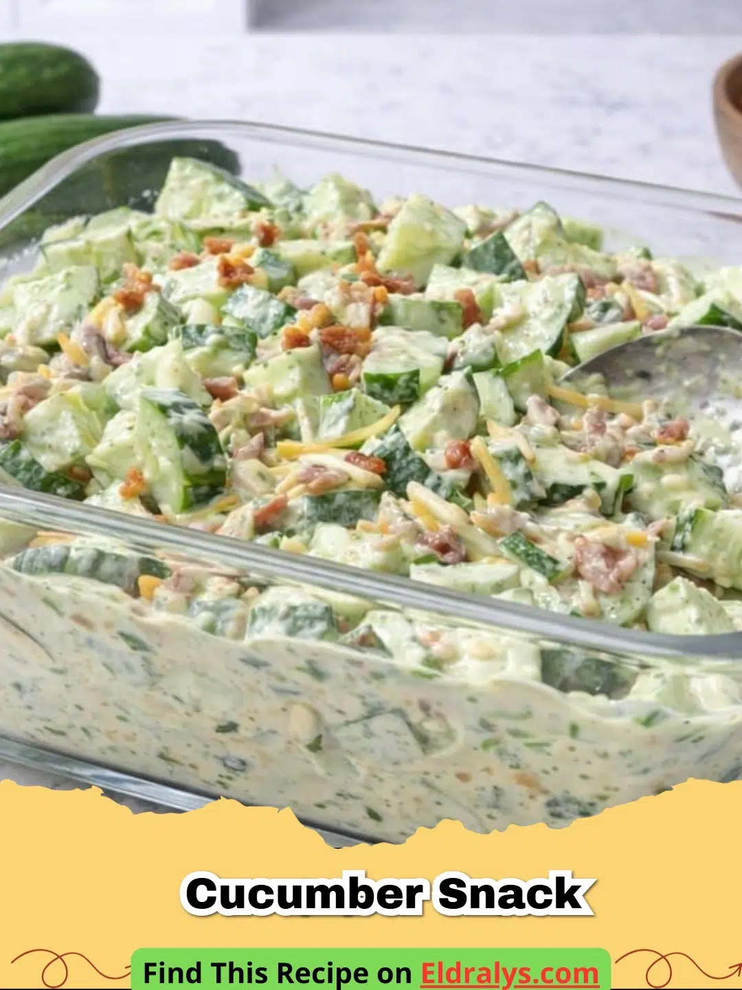 A close-up of a Loaded Cucumber Salad with Avocado Lime Ranch in a white bowl.