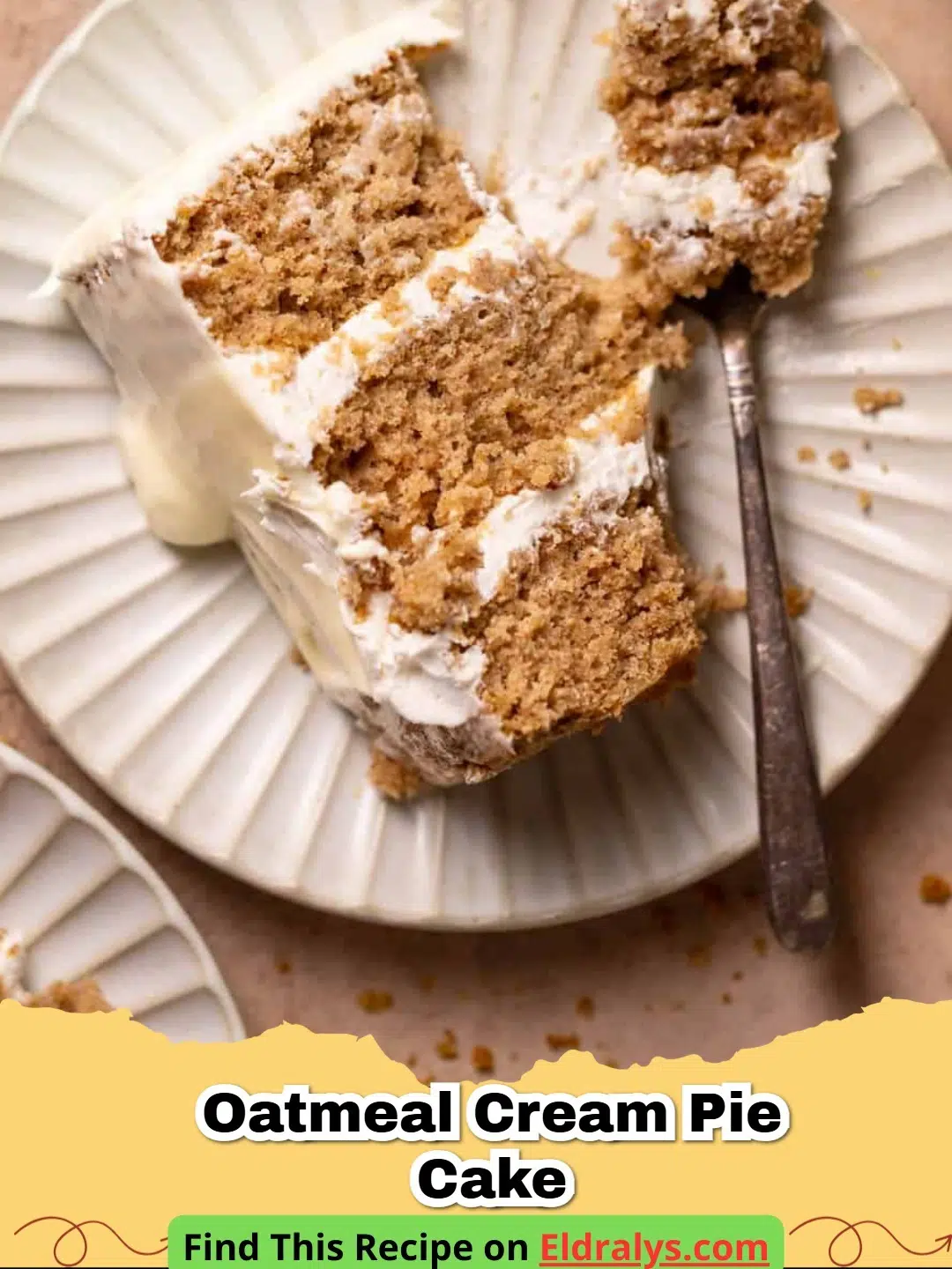 A multi-layered Oatmeal Cream Pie Cake with fluffy white frosting and a sprinkle of cinnamon.