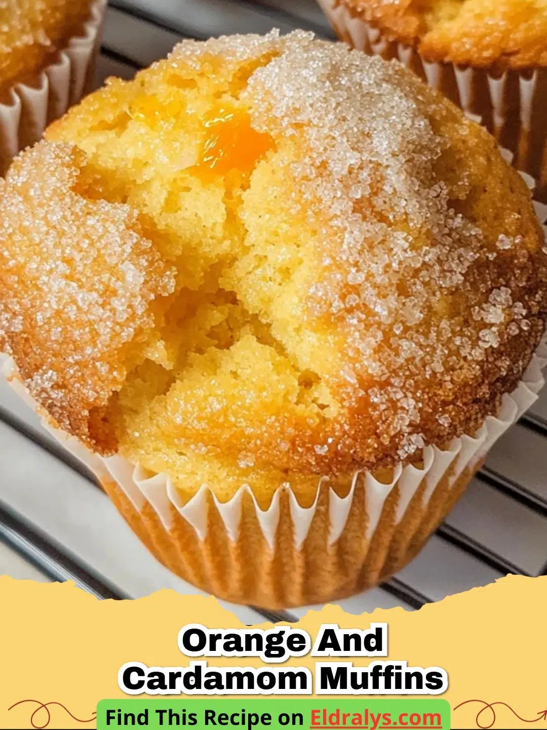 Golden brown Orange and Cardamom Muffins with orange zest on top