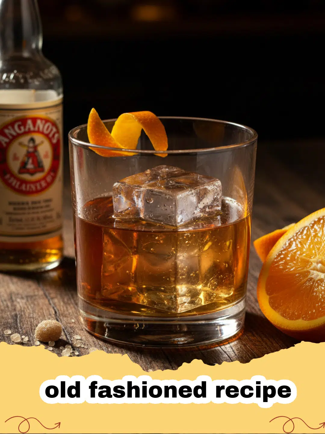 old fashioned recipe - A classic Old Fashioned cocktail in a rocks glass with a large ice cube and an orange twist.