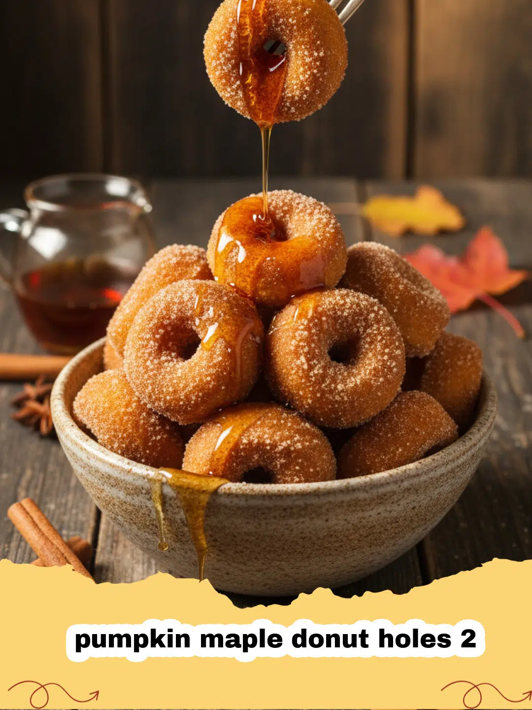 A pile of glazed pumpkin maple donut holes 2 on a wire rack