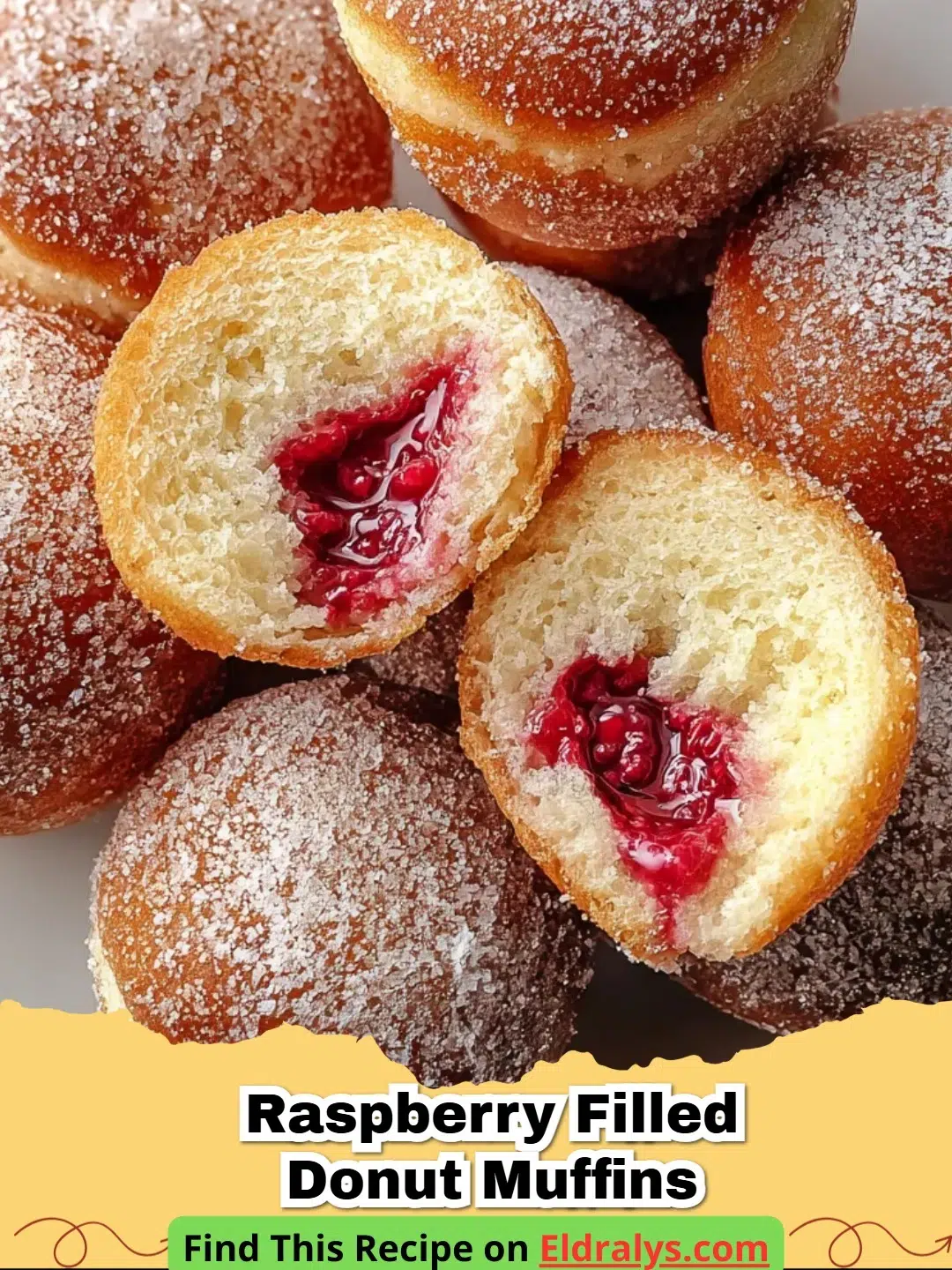 Close up of Raspberry Filled Donut Muffins showing the sugary crust and jam center.