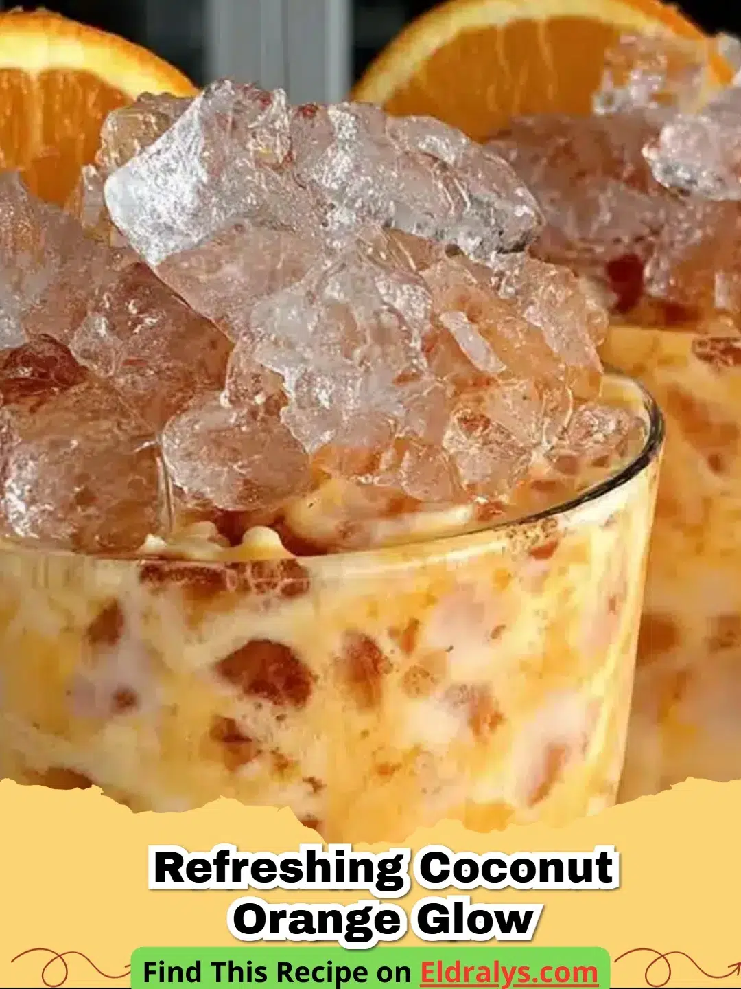 A bright orange Refreshing Coconut Orange Glow drink in a tall glass with coconut milk swirls.