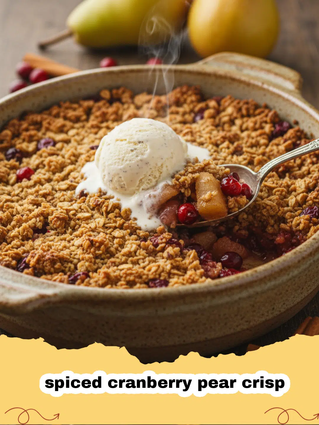A golden brown spiced cranberry pear crisp in a white baking dish with melting vanilla ice cream on top.