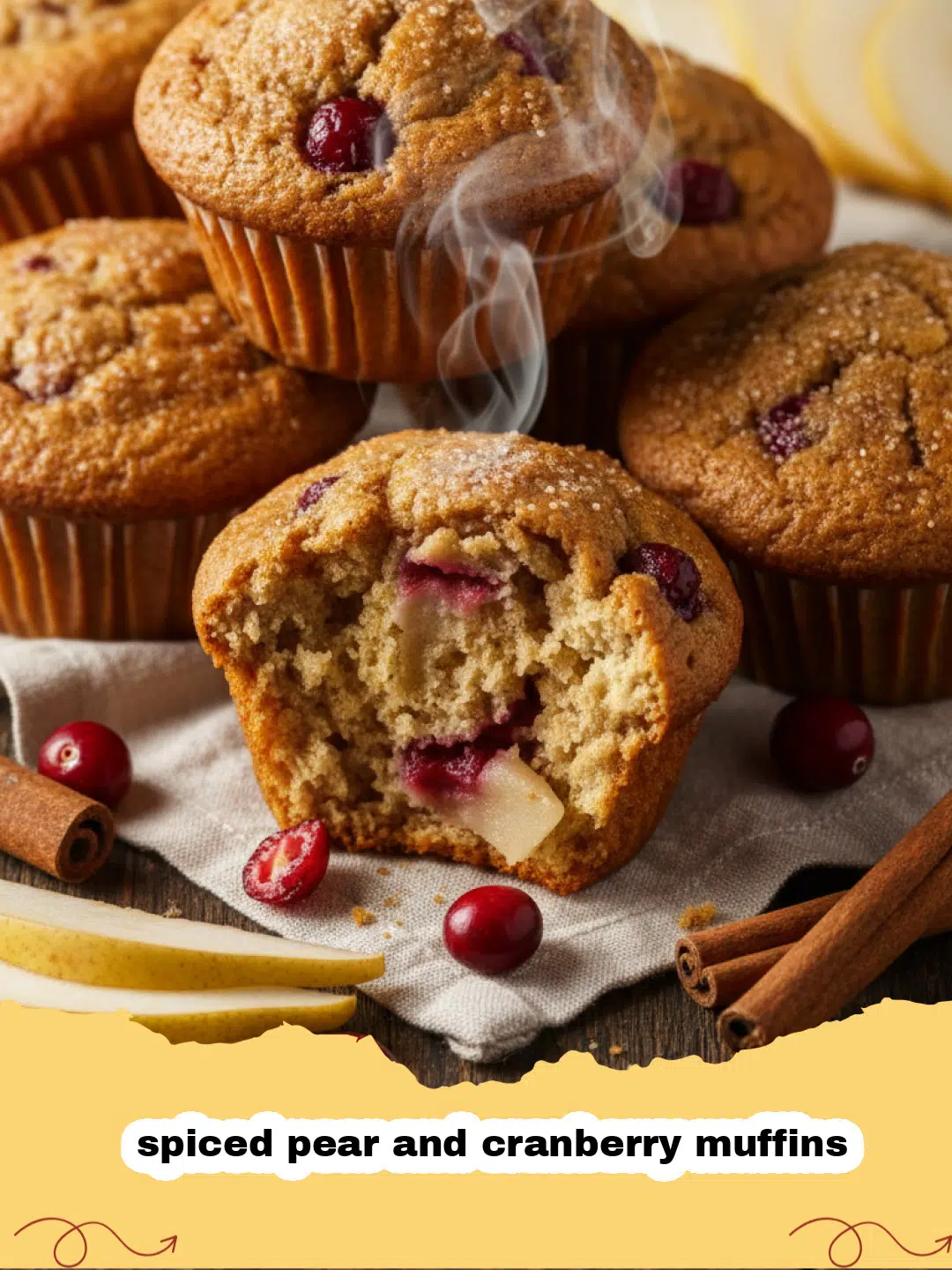 A close up of freshly baked spiced pear and cranberry muffins on a cooling rack