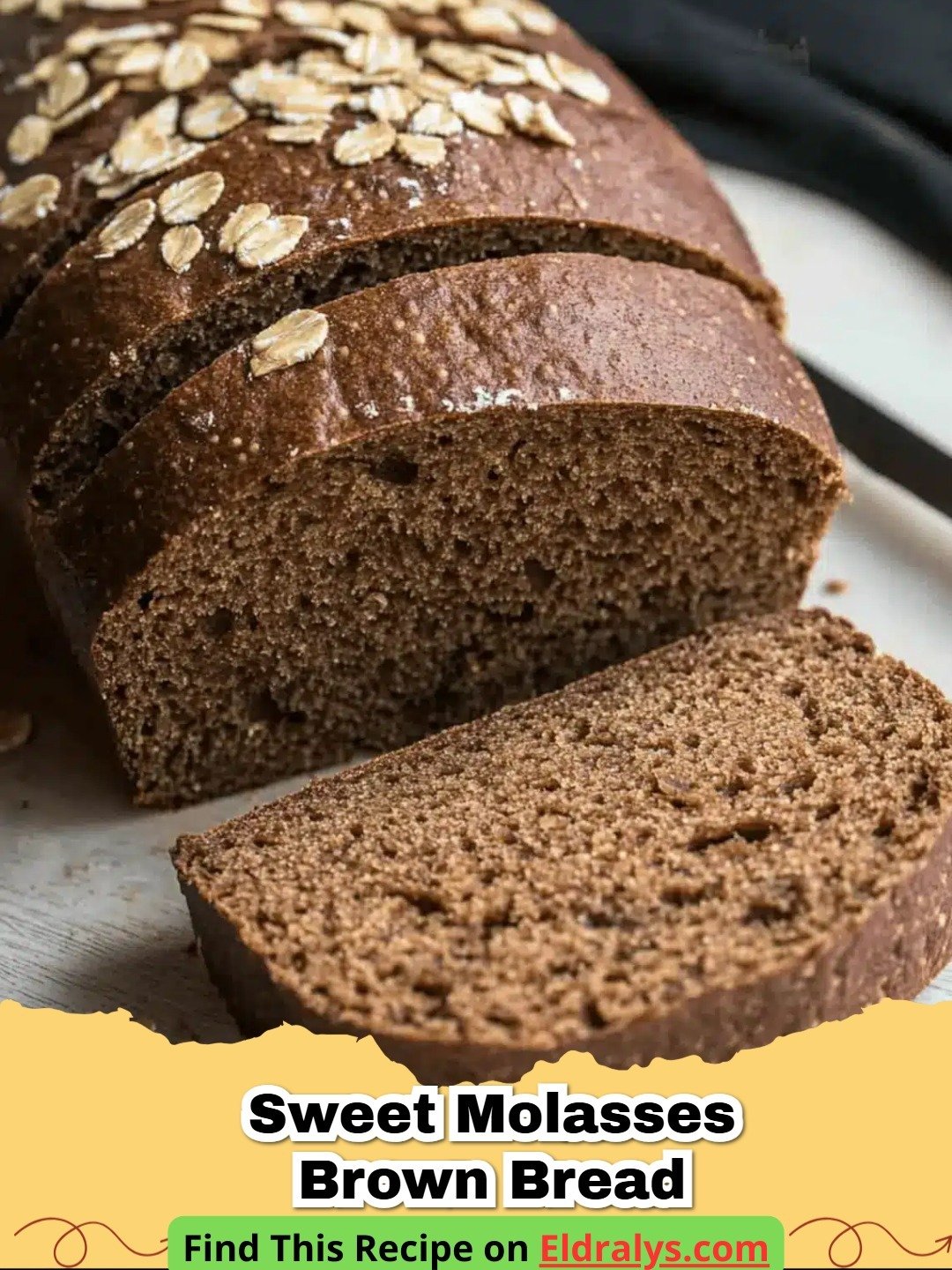 A freshly baked loaf of Sweet Molasses Brown Bread on a wooden board with butter.