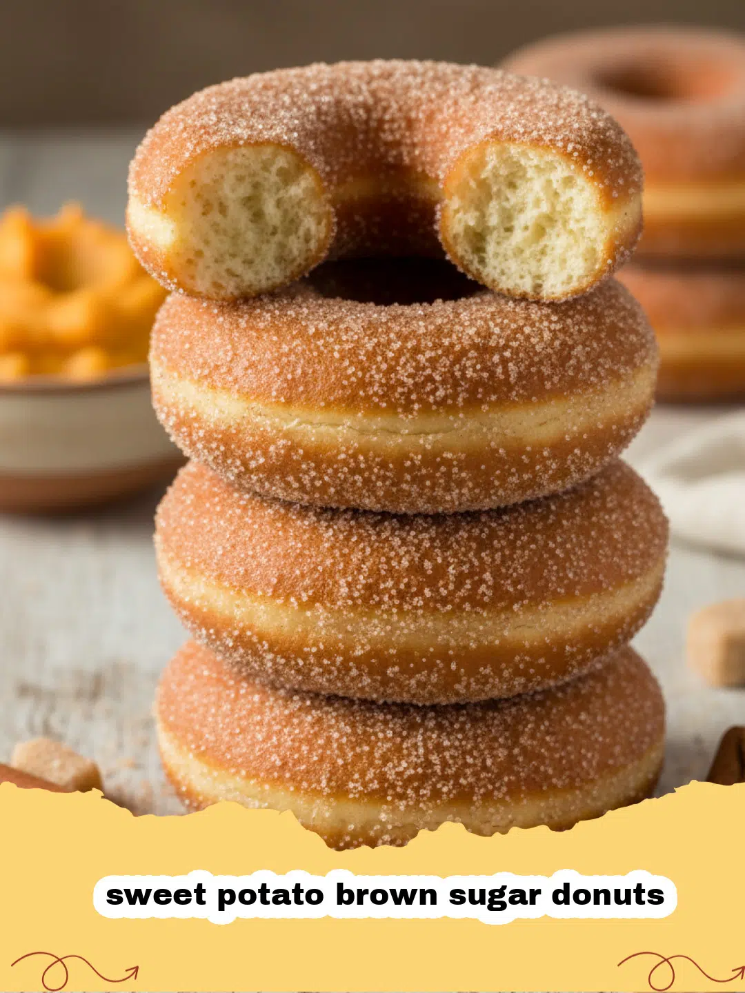 A stack of golden brown sweet potato brown sugar donuts coated in cinnamon sugar.