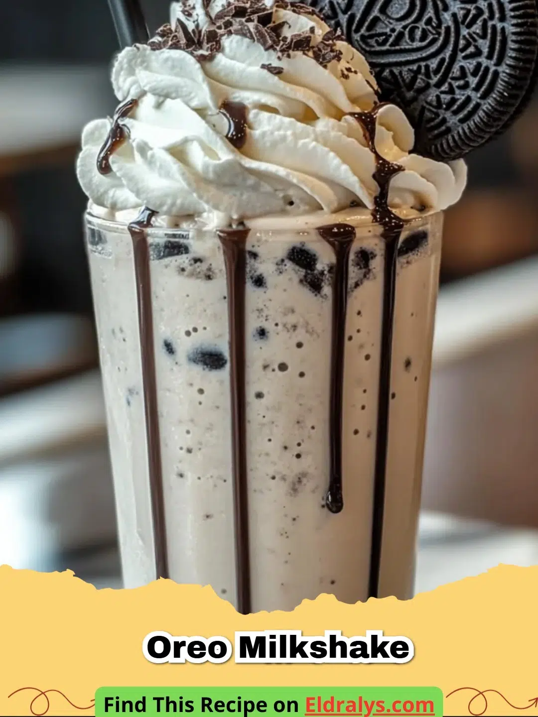 A thick Oreo Milkshake topped with whipped cream and cookies in a tall glass.
