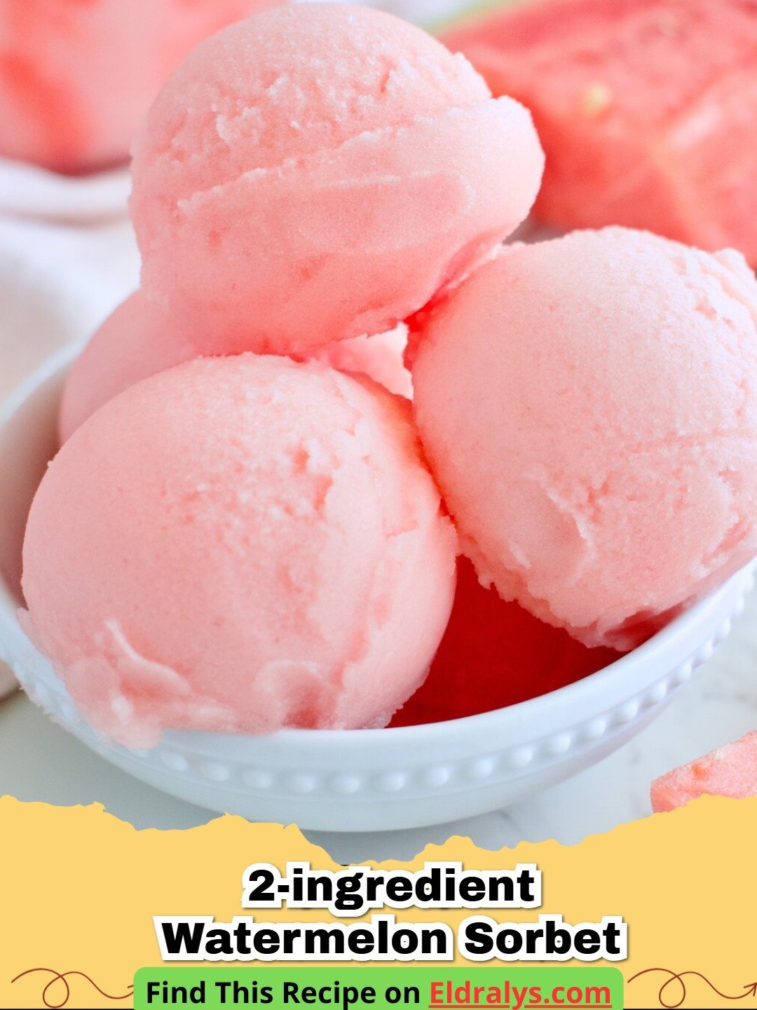 A scoop of vibrant pink 2-ingredient watermelon sorbet in a white bowl with a lime wedge garnish.