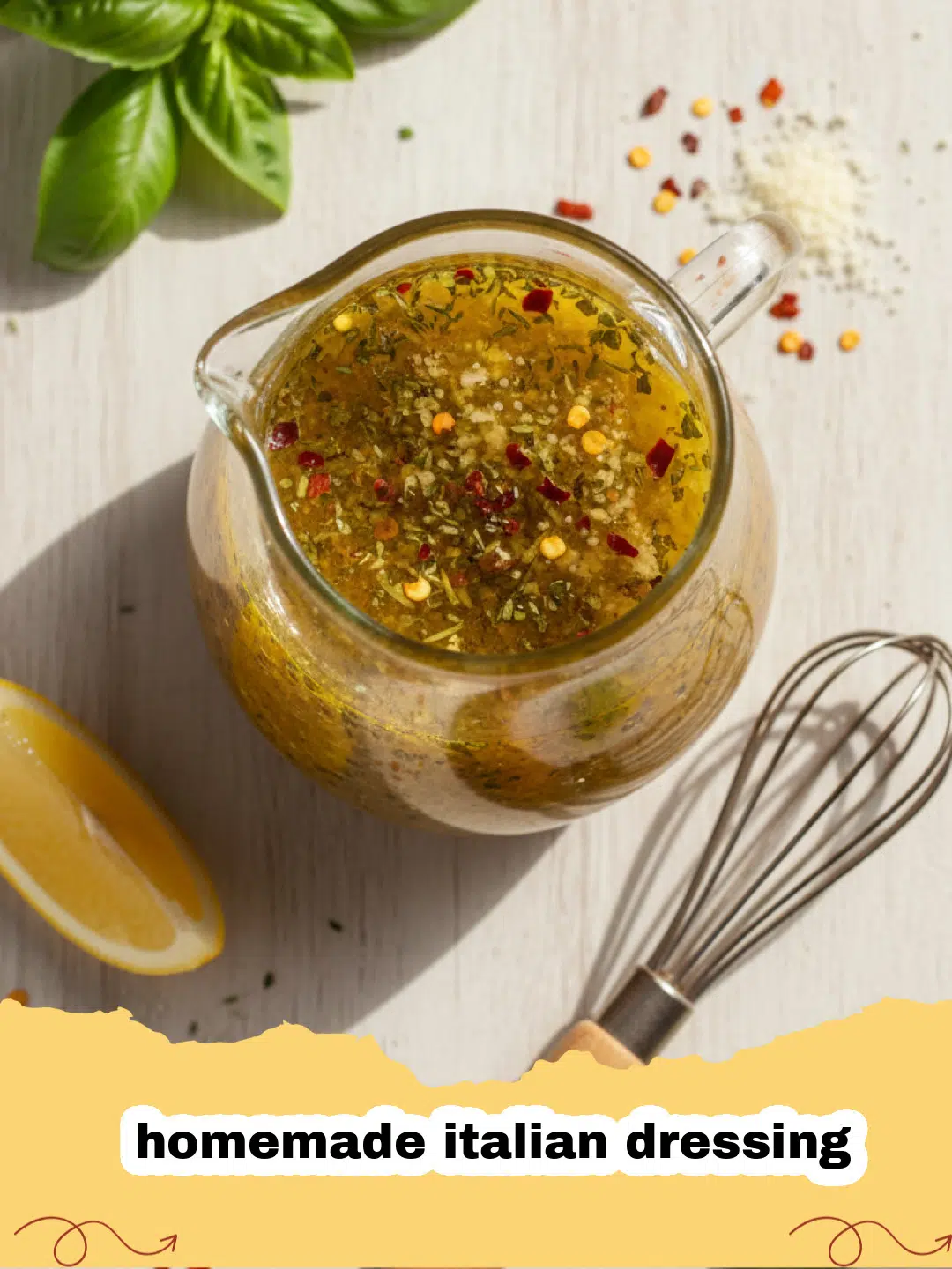 homemade italian dressing - A glass jar of vibrant homemade Italian dressing with fresh herbs and spices visible, next to a bowl of fresh green salad.