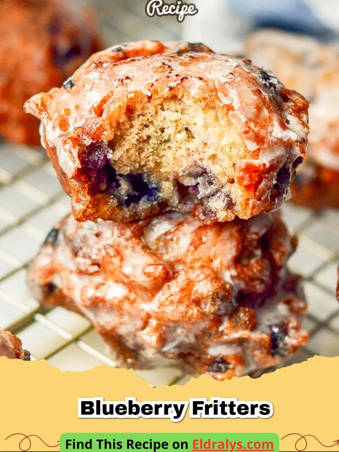 Golden-brown Blueberry Fritters covered in a white sugar glaze on a wire rack.