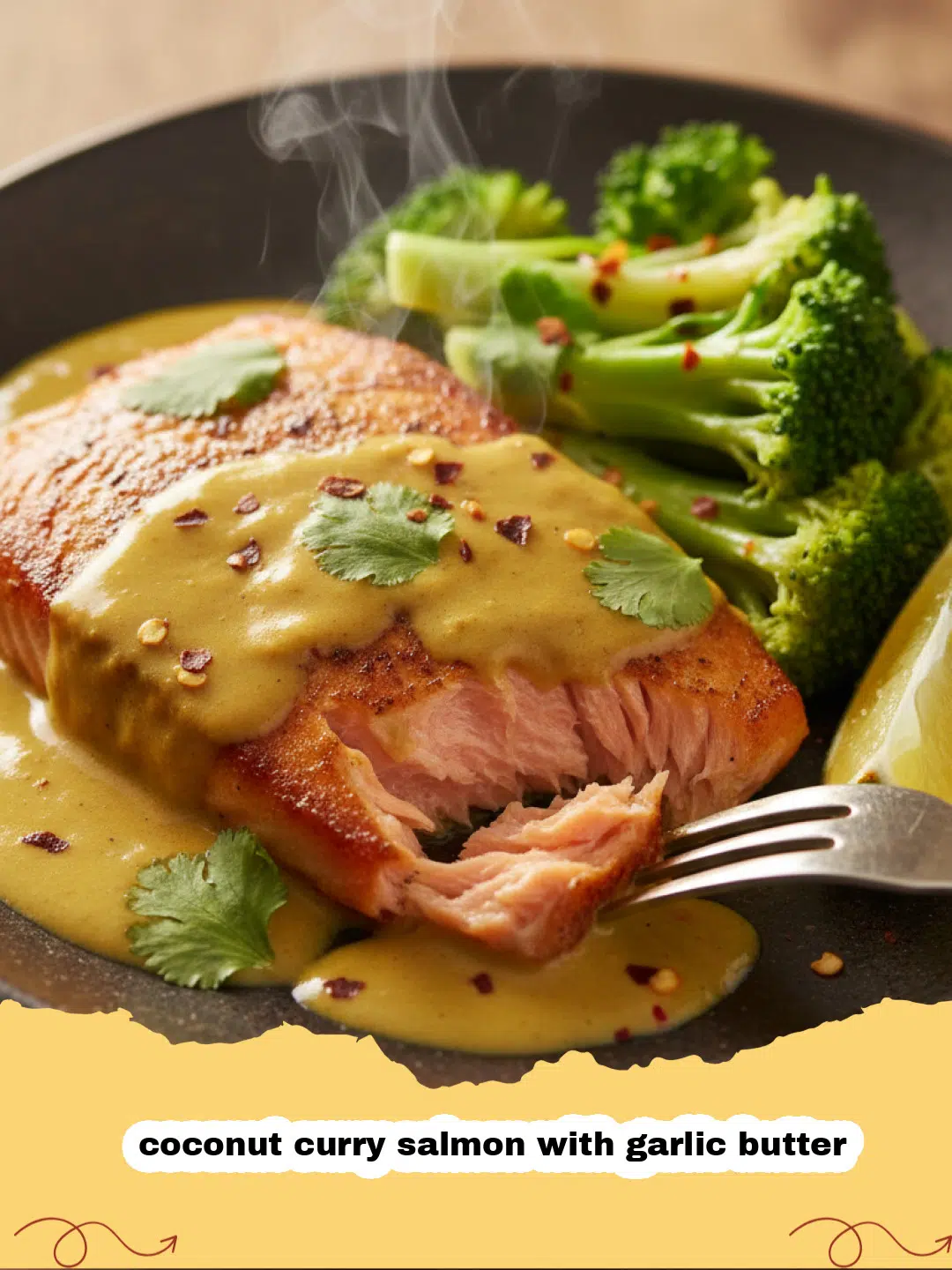 Close-up of coconut curry salmon with garlic butter, garnished with fresh cilantro and a lime wedge, served over rice.