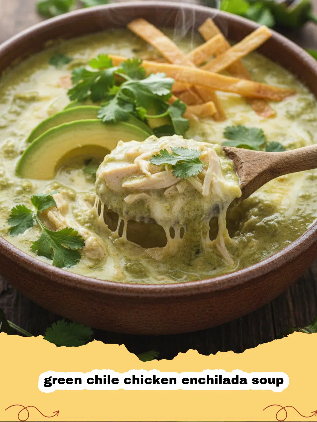 A steaming bowl of creamy green chile chicken enchilada soup topped with fresh cilantro, shredded cheese, and avocado slices.